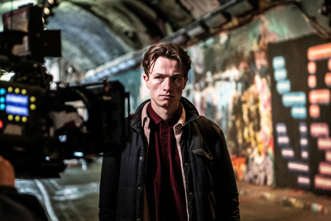 an image of a man being filmed on a film set