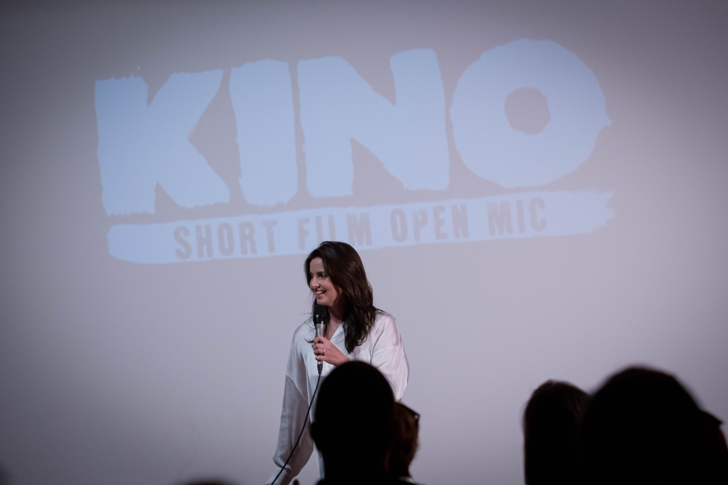 woman partaking in indie film group, Kino's short film open mic night